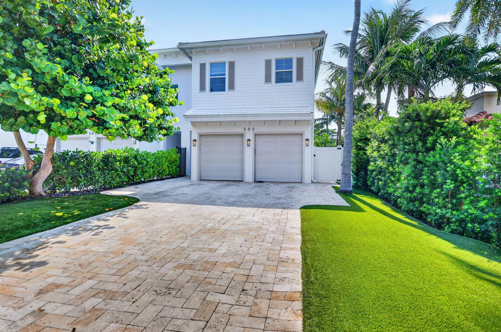 A two-story white house with a two-car garage and a paved driveway — 500 NE Wavecrest Way, Boca Raton FL 33432, BOCA RATON, FL