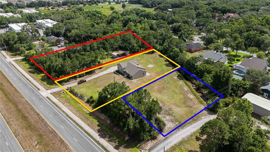 An aerial view shows three adjacent plots of land with a house on the center lot — 1300 S NARCOOSSEE ROAD, ST CLOUD, FL