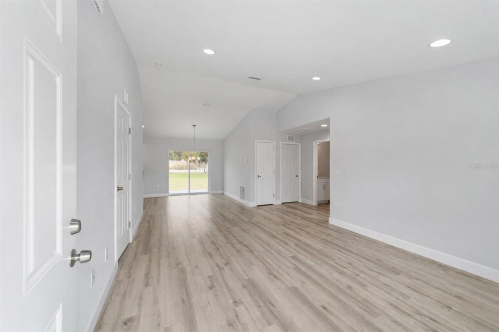 A single-story gray house with a white garage door and a front porch — 15342 SW 38TH PLACE, OCALA, FL