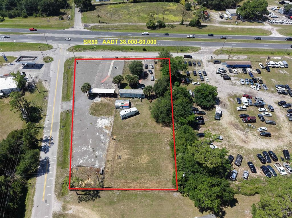 An aerial view shows a rectangular lot outlined in red next to a major highway — 17925 OLD CHENEY HWY, ORLANDO, FL