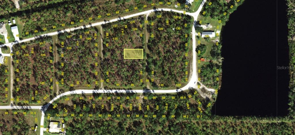 This is an aerial map showing a highlighted vacant residential lot in a wooded area — 13347 CAPPY TERRACE, PUNTA GORDA, FL