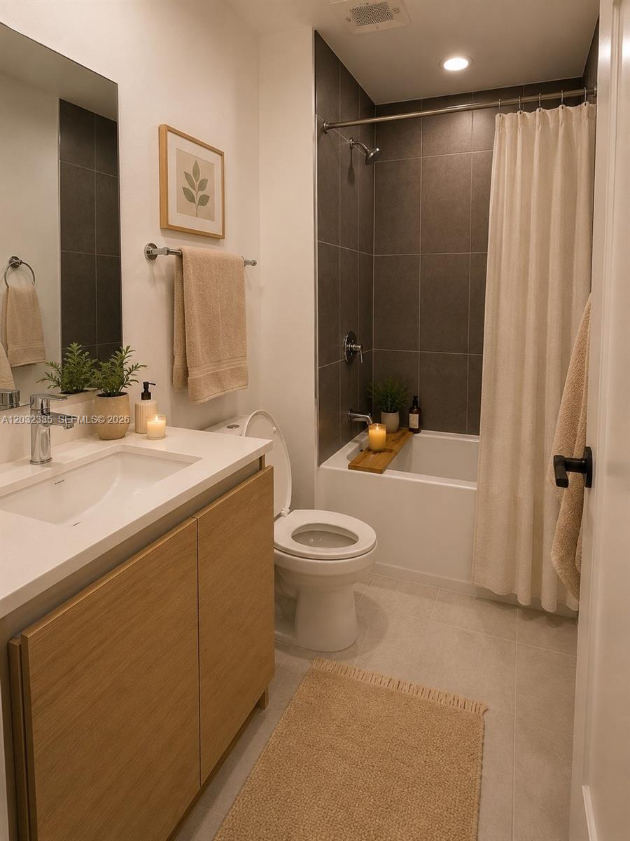 A modern bathroom features a light wood vanity, a white toilet, and a tiled shower — 8106 NE 1st Ave # 3, Miami FL 33138, MIAMI, FL
