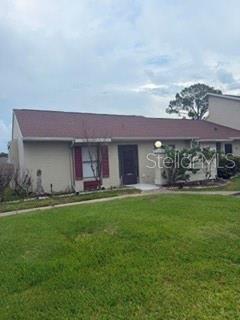 A single-story residential building with a brown shingled roof and a front entrance — 108 PINE ISLAND CIRCLE, KISSIMMEE, FL