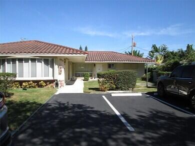 A single-story house with a tiled roof and a paved parking area in front — 1911 NE 27th Court # 3, Lighthouse Point FL 33064, LIGHTHOUSE POINT, FL