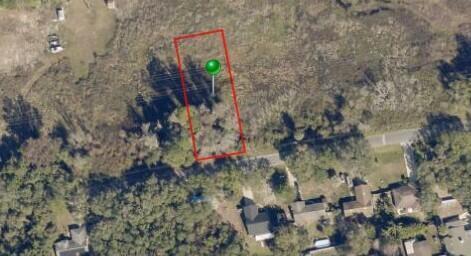 An aerial view shows a rectangular plot of land outlined in red with a green marker — 264 Toms Road, FL 32713, FL