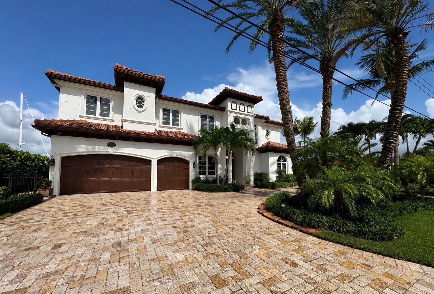 A two-story white stucco house with a tile roof and a paved driveway — 4431 NE 24th Avenue, Lighthouse Point FL 33064, LIGHTHOUSE POINT, FL