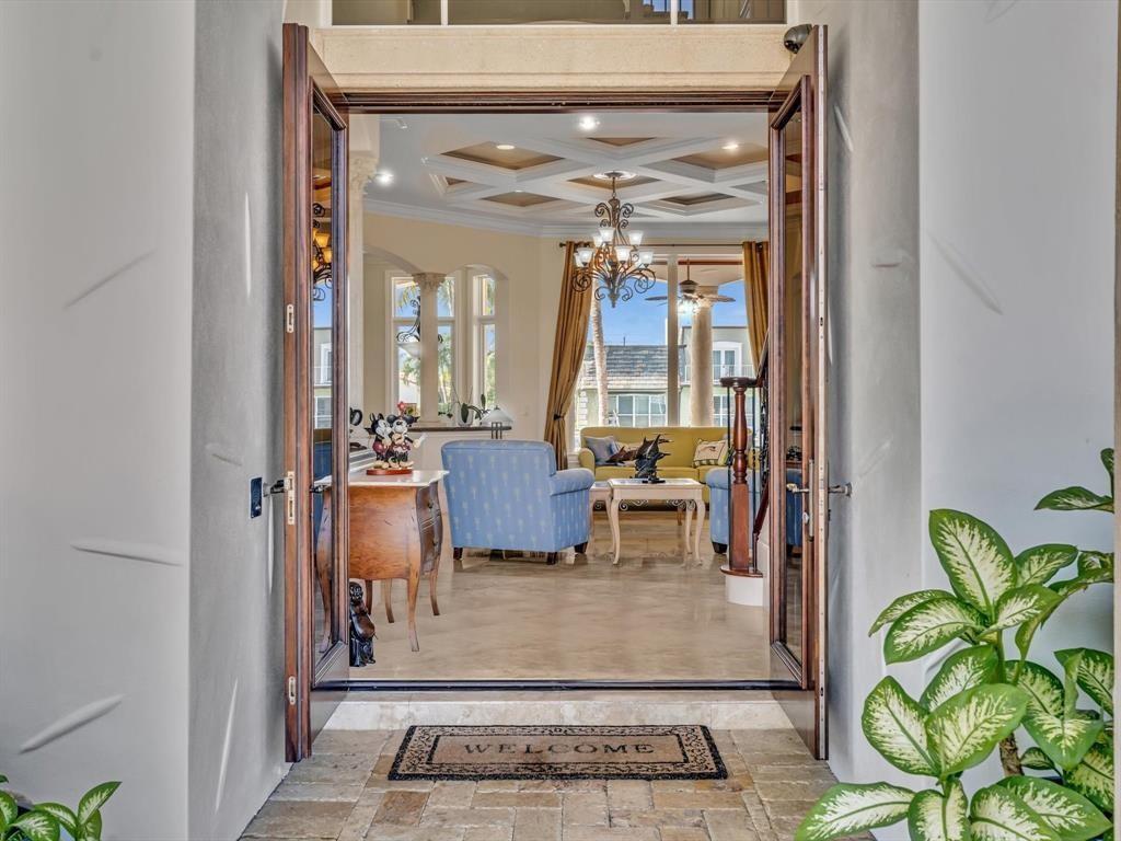 A view through an open doorway into a living room with a coffered ceiling — 4431 NE 24th Avenue, Lighthouse Point FL 33064, LIGHTHOUSE POINT, FL