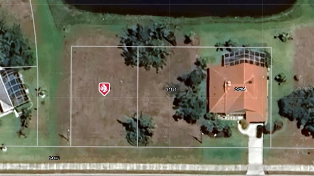 This aerial map shows two adjacent residential lots, one vacant and one with a house — 24188 VINCENT AVENUE, PUNTA GORDA, FL