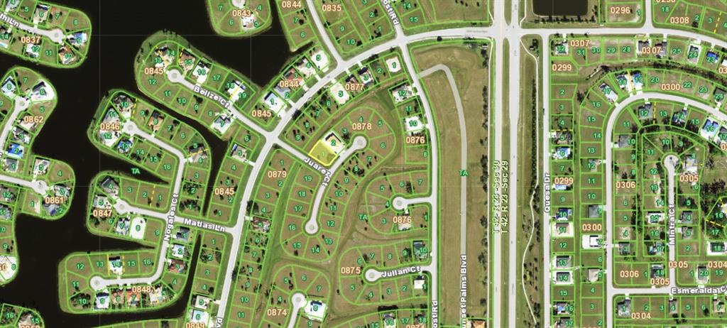 This is an aerial map showing residential lots, streets, and water features in a neighborhood — 16269 JUAREZ CIRCLE, PUNTA GORDA, FL