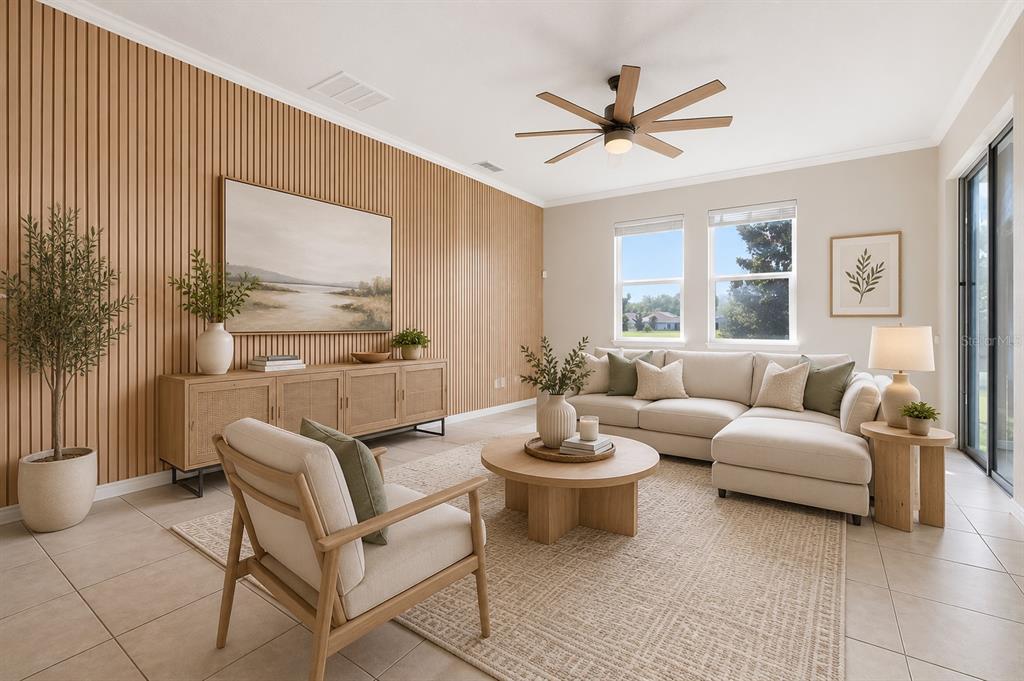 An open-concept living and dining area features light tile flooring, neutral walls, and sliding doors — 1494 CHELSEA MANOR CIRCLE, DELAND, FL