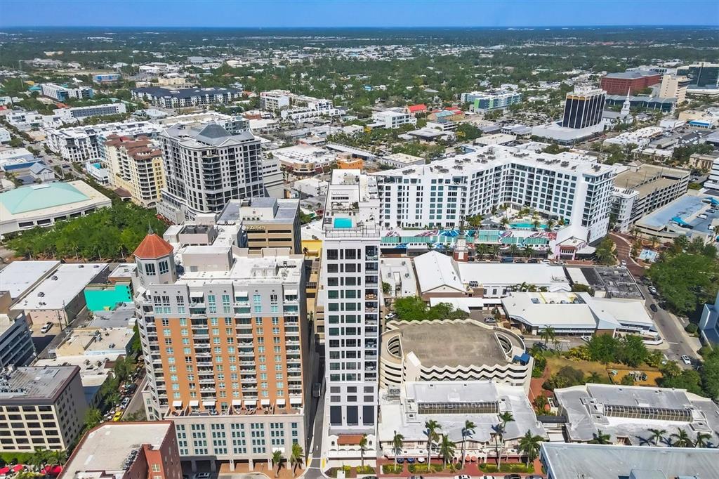 Aerial view of a dense urban area featuring high-rise residential buildings and surrounding city streets — 33 S PALM AVENUE UNIT 1503, SARASOTA, FL