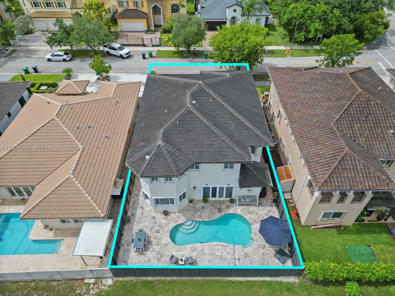 An aerial view shows a two-story house with a backyard pool and patio area — 15651 SW 14th St, Miami FL 33194, MIAMI, FL