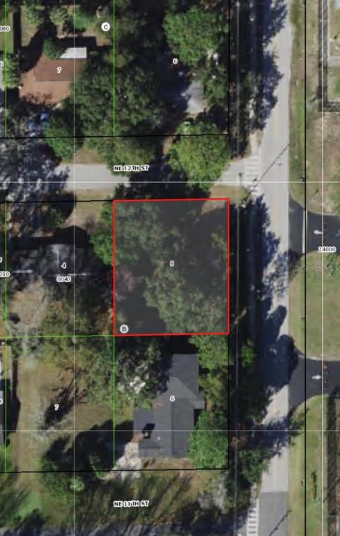 This is an aerial map view of a rectangular vacant lot highlighted in red — 764 NE 12TH STREET, CRYSTAL RIVER, FL