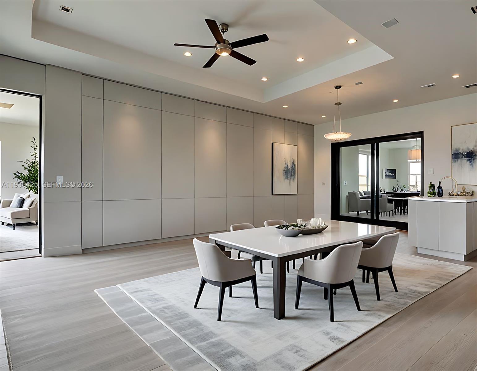 A modern dining room features a white table, upholstered chairs, and a large paneled wall — OTHER CITY - IN THE STATE OF FLORIDA, FL