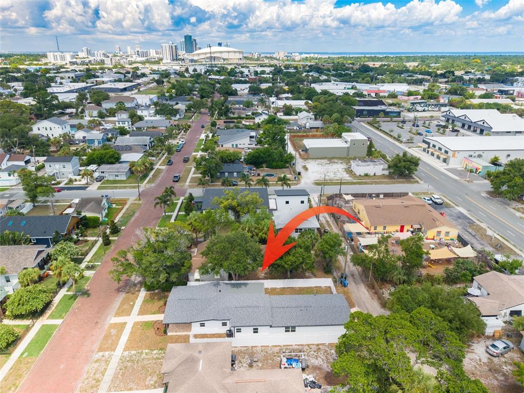 An aerial view shows a residential property with a white fence and a red arrow — 2528 4TH AVENUE S, ST PETERSBURG, FL