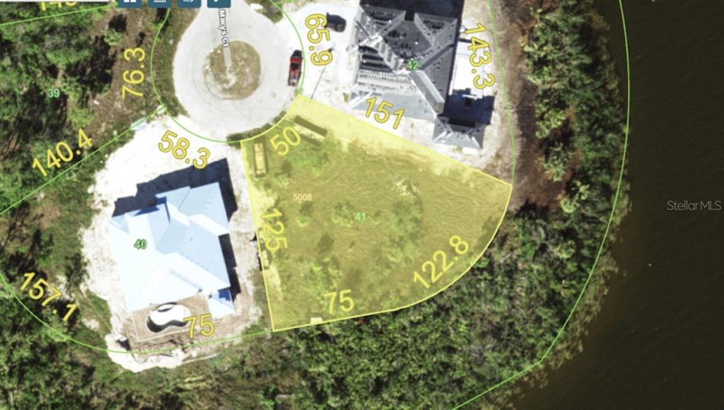 This is an aerial map showing a vacant residential lot situated between two existing homes — 9488 ST MARYS COURT, PORT CHARLOTTE, FL