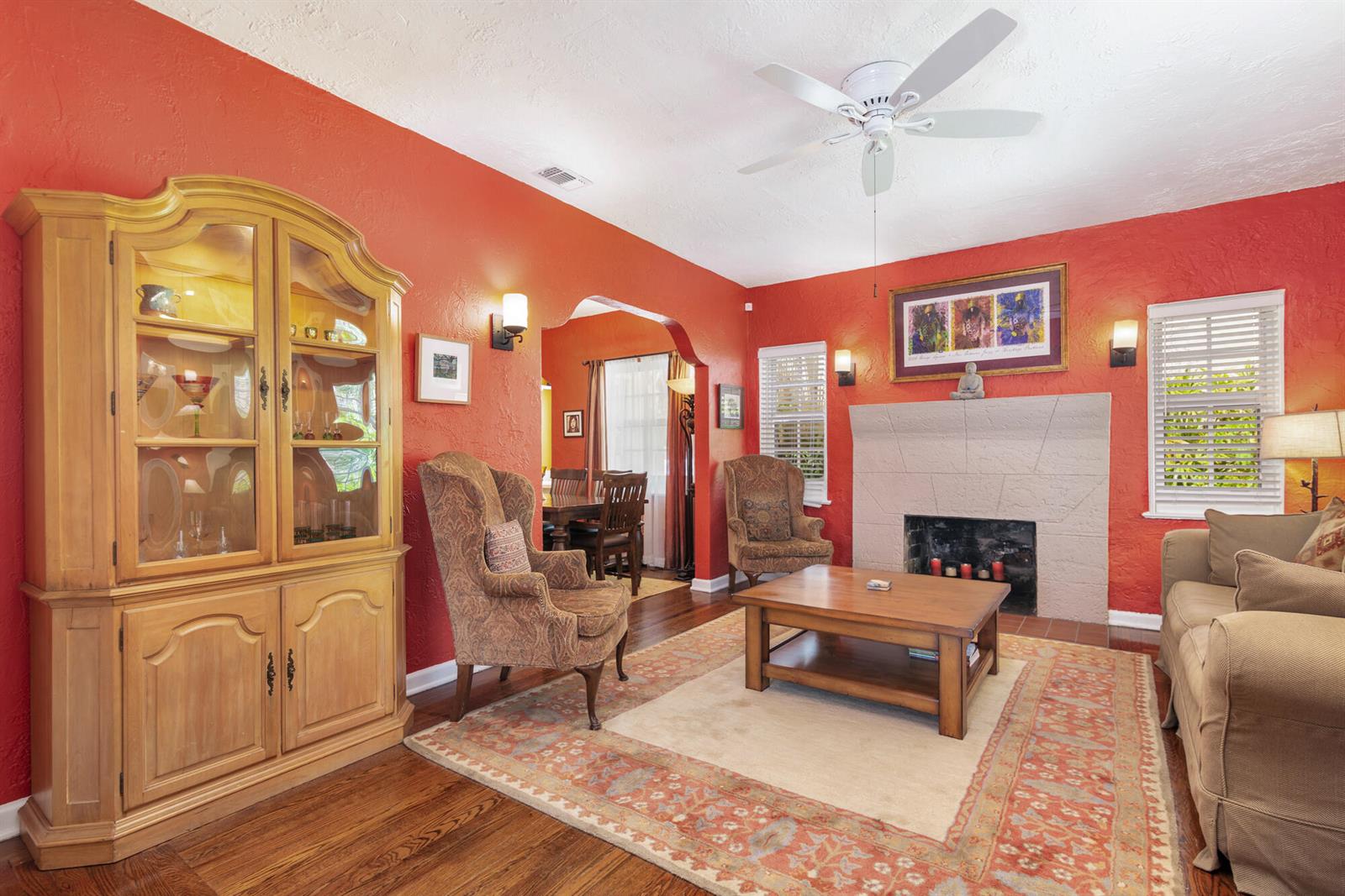 A living room features a fireplace, a ceiling fan, a hutch, and a dining area — 714 Sunset Road, West Palm Beach FL 33401, WEST PALM BEACH, FL
