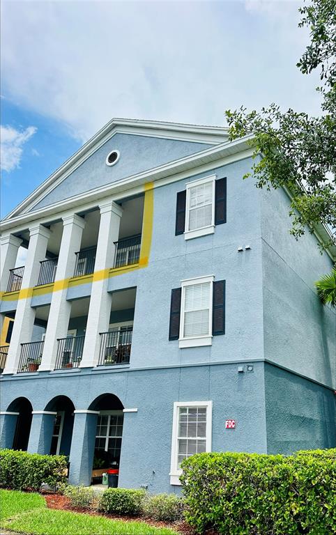 A three-story blue building features a columned porch and a fire department connection — 3713 CONROY ROAD UNIT 1932, ORLANDO, FL