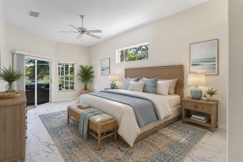 A bedroom features a king bed, a woven bench, and a sliding glass door — 6381 PINEHURST DRIVE, SPRING HILL, FL