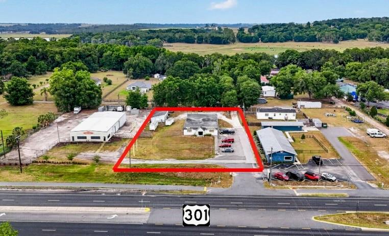 This aerial map shows a commercial property outlined in red along a highway — 10221 US HIGHWAY 301, DADE CITY, FL
