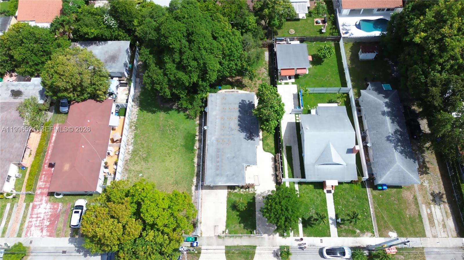 An aerial view shows several residential properties with houses, driveways, and green lawns — 3121-3123 SW 25th Ter, Miami FL 33133, MIAMI, FL
