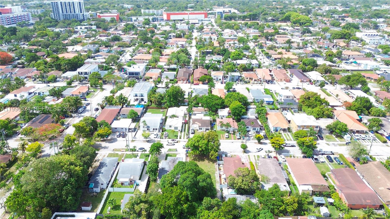 An aerial view shows a residential neighborhood with houses, trees, and streets — 3121-3123 SW 25th Ter, Miami FL 33133, MIAMI, FL