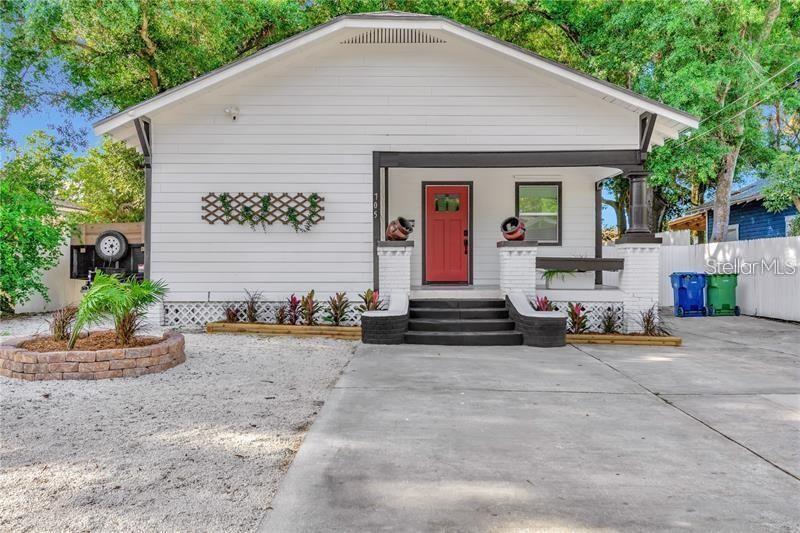 A white house with a red front door, a front porch, and a gravel yard — 705 E PLYMOUTH STREET, TAMPA, FL