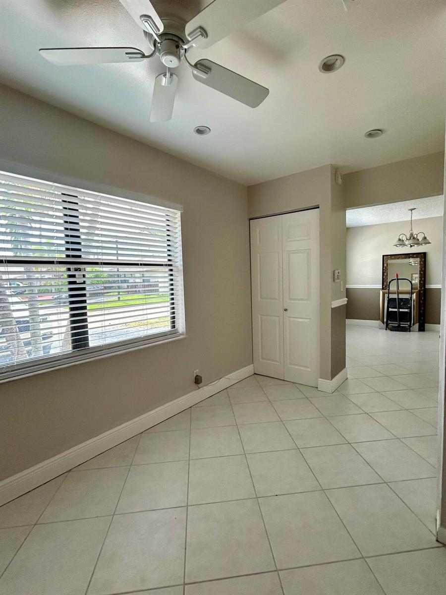 A room with light-colored tile flooring, a ceiling fan, and a window with blinds — 16415 Berry Way, Delray Beach FL 33484, DELRAY BEACH, FL
