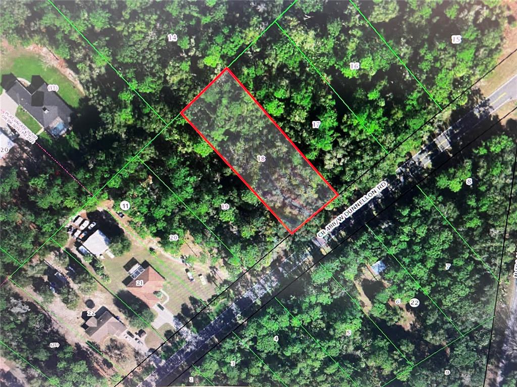 This is an aerial map showing a rectangular plot of land highlighted in red — 10047 W DUNNELLON ROAD, CRYSTAL RIVER, FL