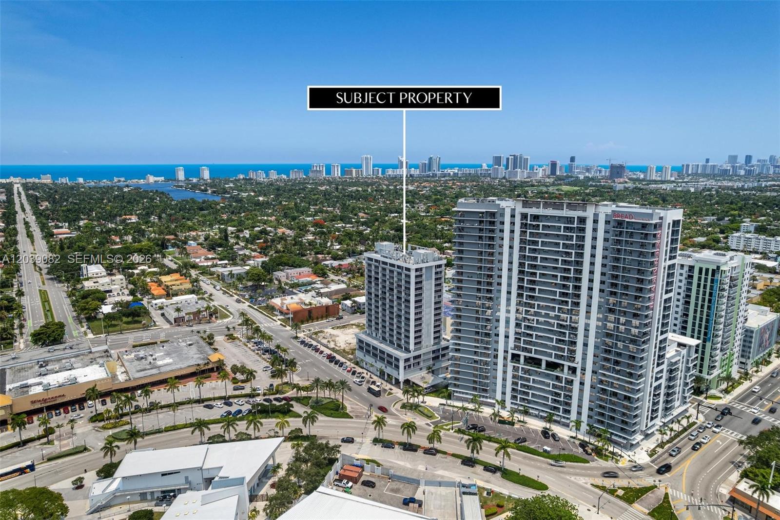 An aerial view shows a tall residential building marked as the subject property near roads — 1720 Harrison St # 16A, Hollywood FL 33020, HOLLYWOOD, FL