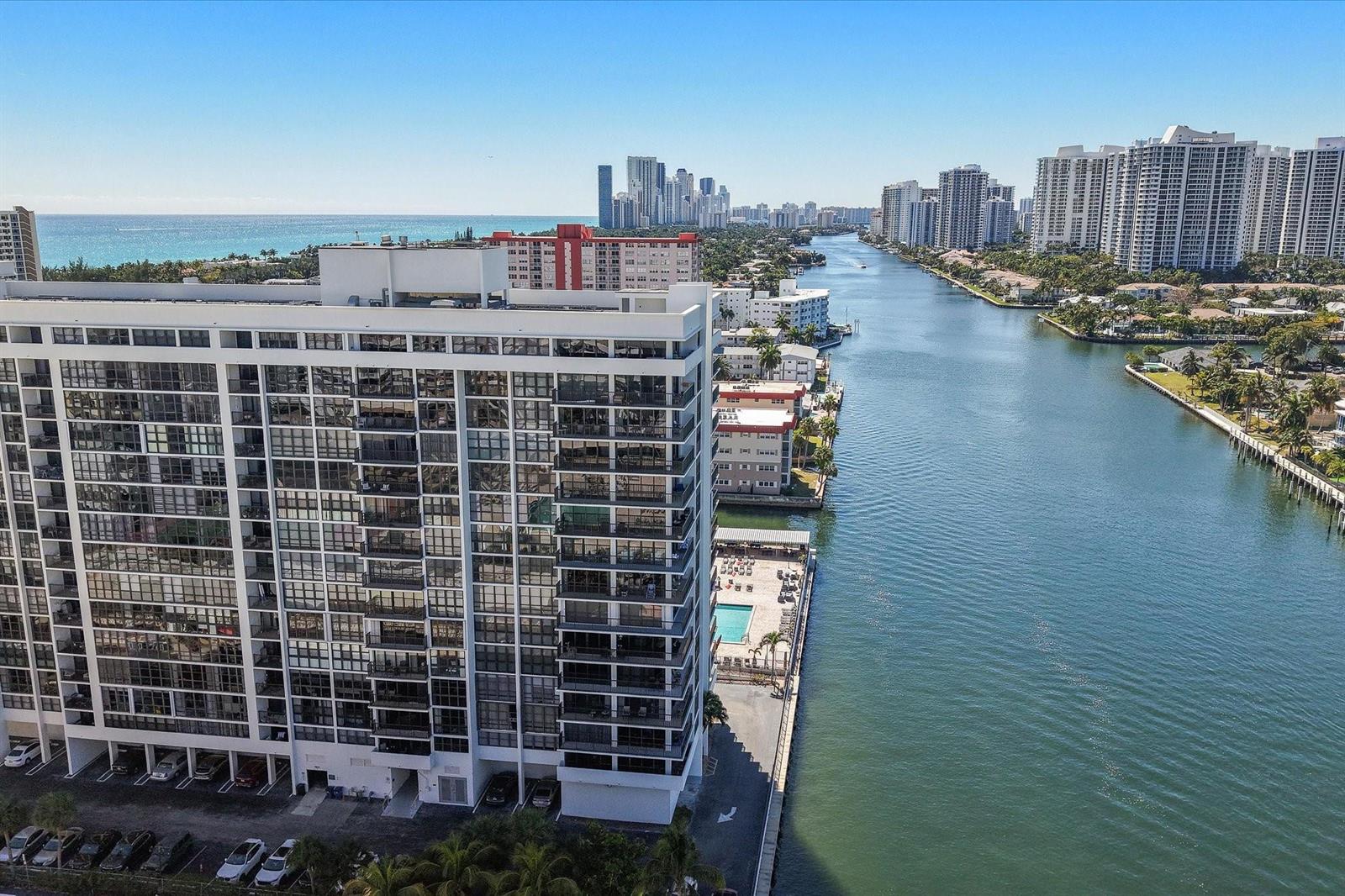 An aerial view of a white high-rise apartment building situated along a canal — 2017 S Ocean Drive, Hallandale Beach FL 33009, HALLANDALE BEACH, FL