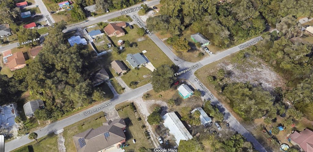 This is an aerial map view of a residential neighborhood intersection with several houses — S THOMPSON STREET, DELAND, FL