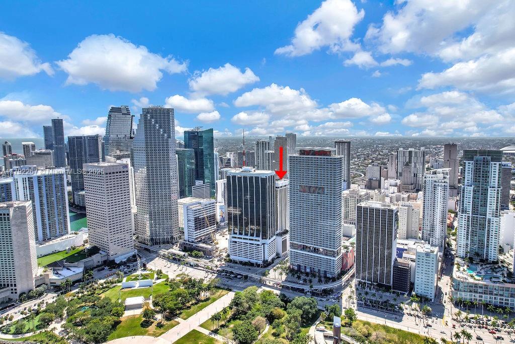 An aerial view of the Miami skyline featuring a red arrow pointing to a building — 1 SE 3rd Ave, Miami FL 33131, MIAMI, FL