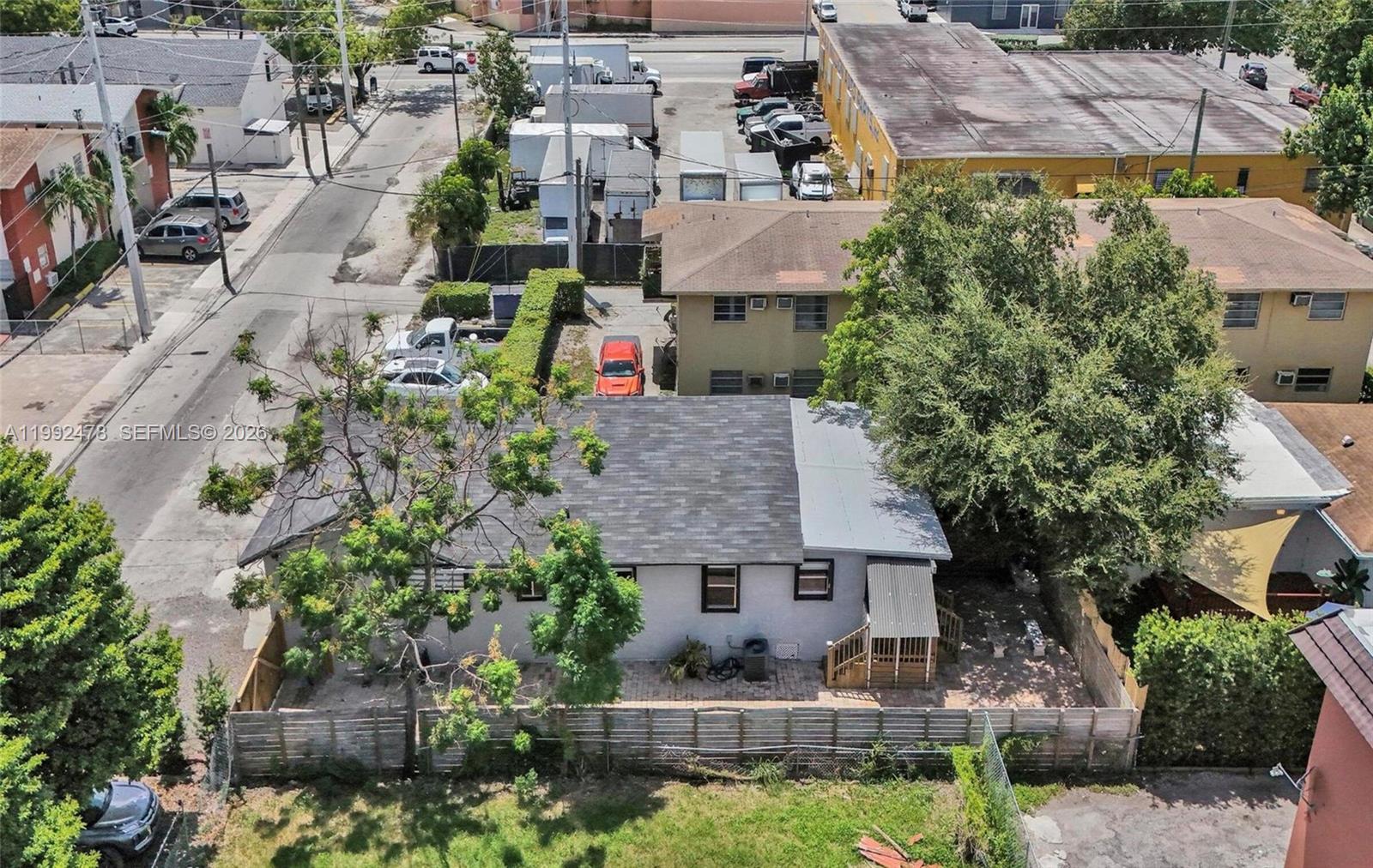 An aerial view shows a single-story house with a backyard and adjacent parking area — 2135 SW 4th St, Miami FL 33135, MIAMI, FL