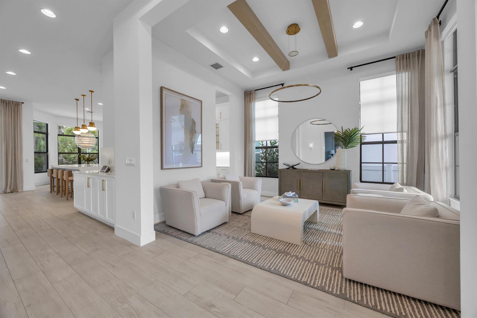 A bright living room with four armchairs, a coffee table, and wood-beam ceiling accents — 13372 Bernoulli Way, Palm Beach Gardens FL 33418, PALM BEACH GARDENS, FL