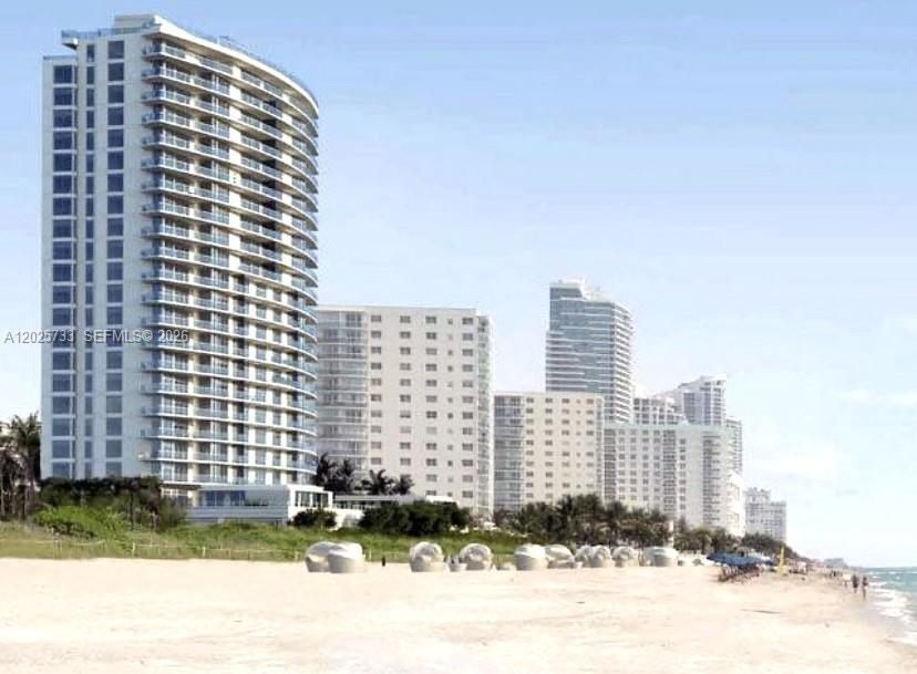 A view of several high-rise residential buildings situated along a sandy beach — 3951 S Ocean Dr # 501, Hollywood FL 33019, HOLLYWOOD, FL