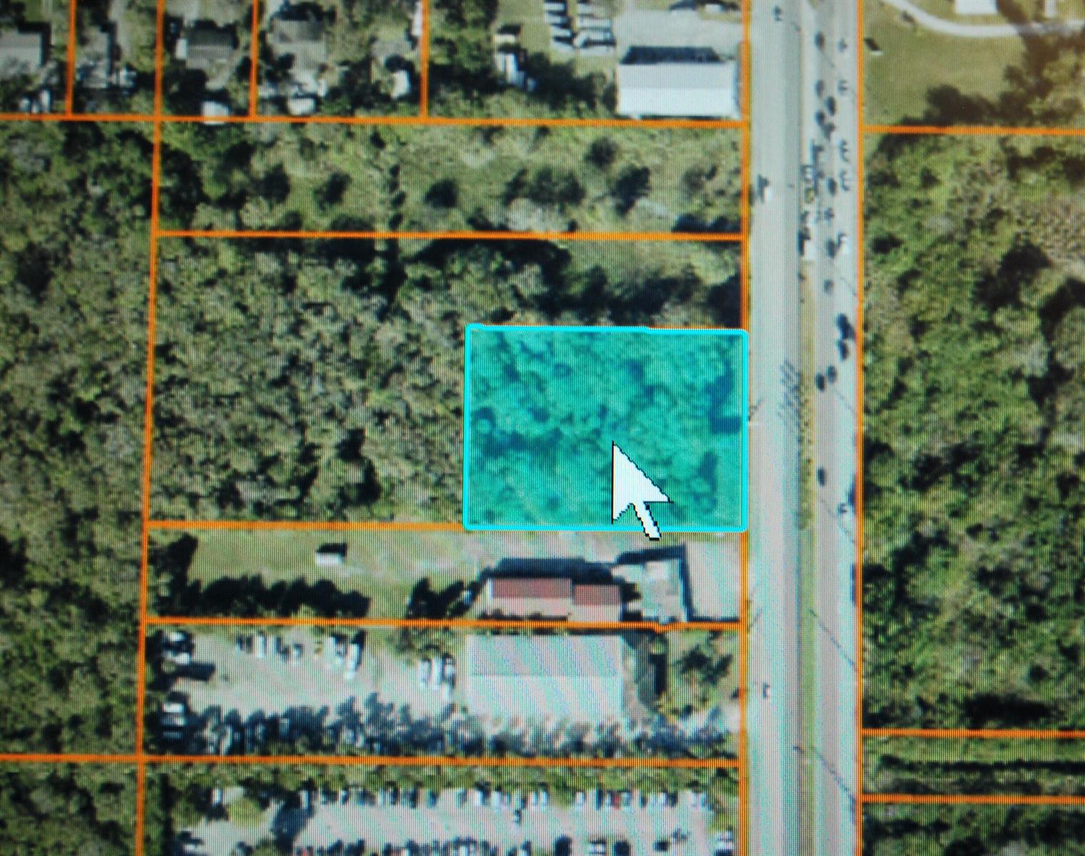 An aerial map view shows a rectangular parcel of land highlighted in blue — 0000 S Us-1, Fort Pierce FL 34982, FORT PIERCE, FL