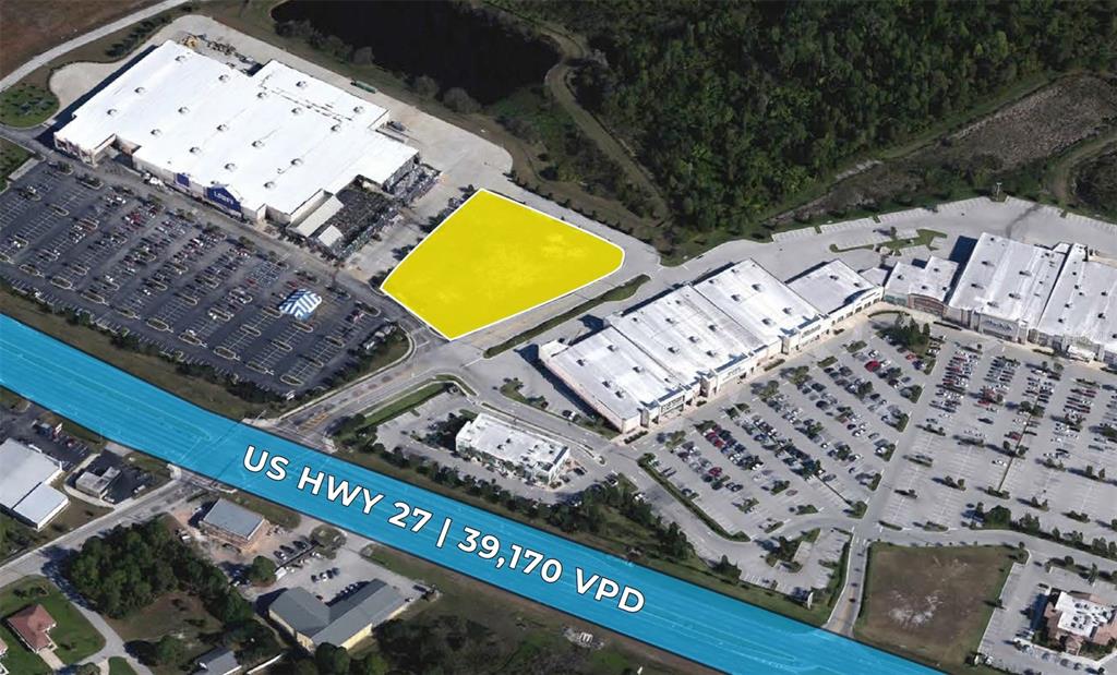 An aerial view shows a vacant yellow-highlighted lot situated between two large retail shopping centers — 2040 US HIGHWAY 27 N, SEBRING, FL