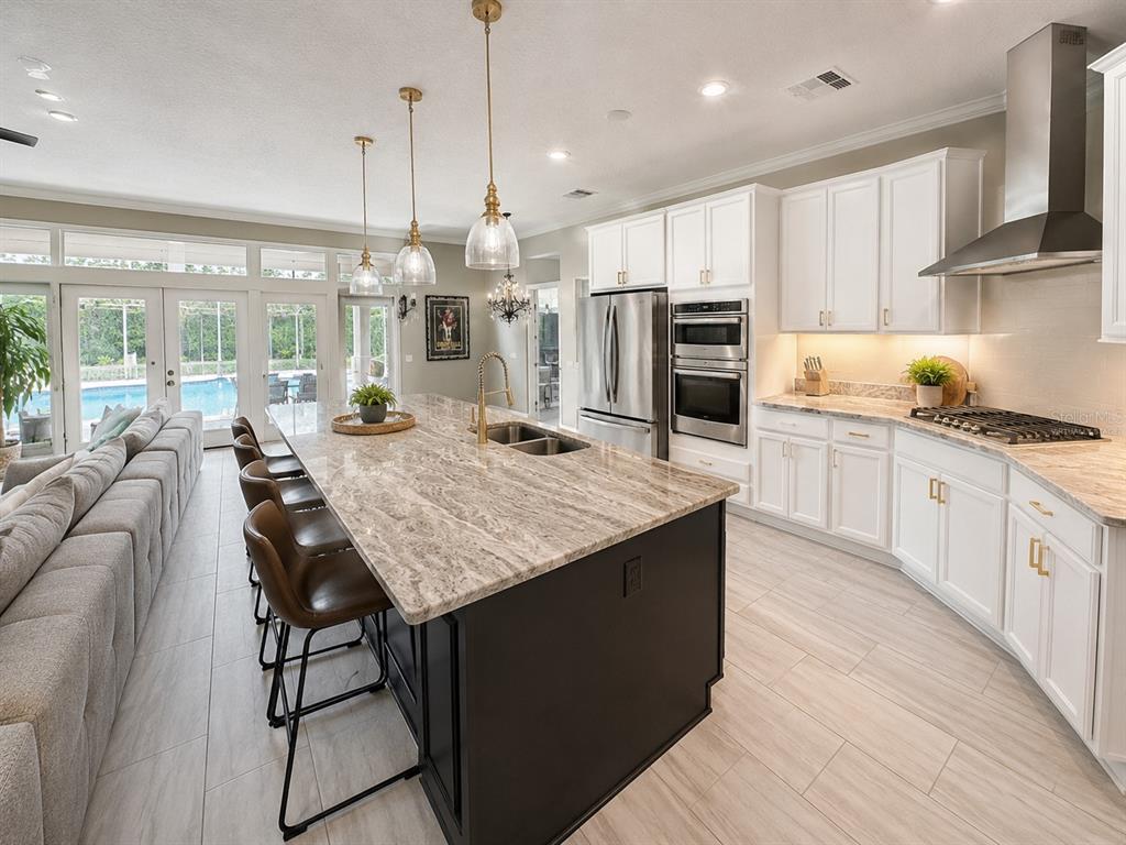 An aerial view shows a house with a brown roof, a screened pool, and a yard — 2260 LANGLEY CIRCLE, ORLANDO, FL