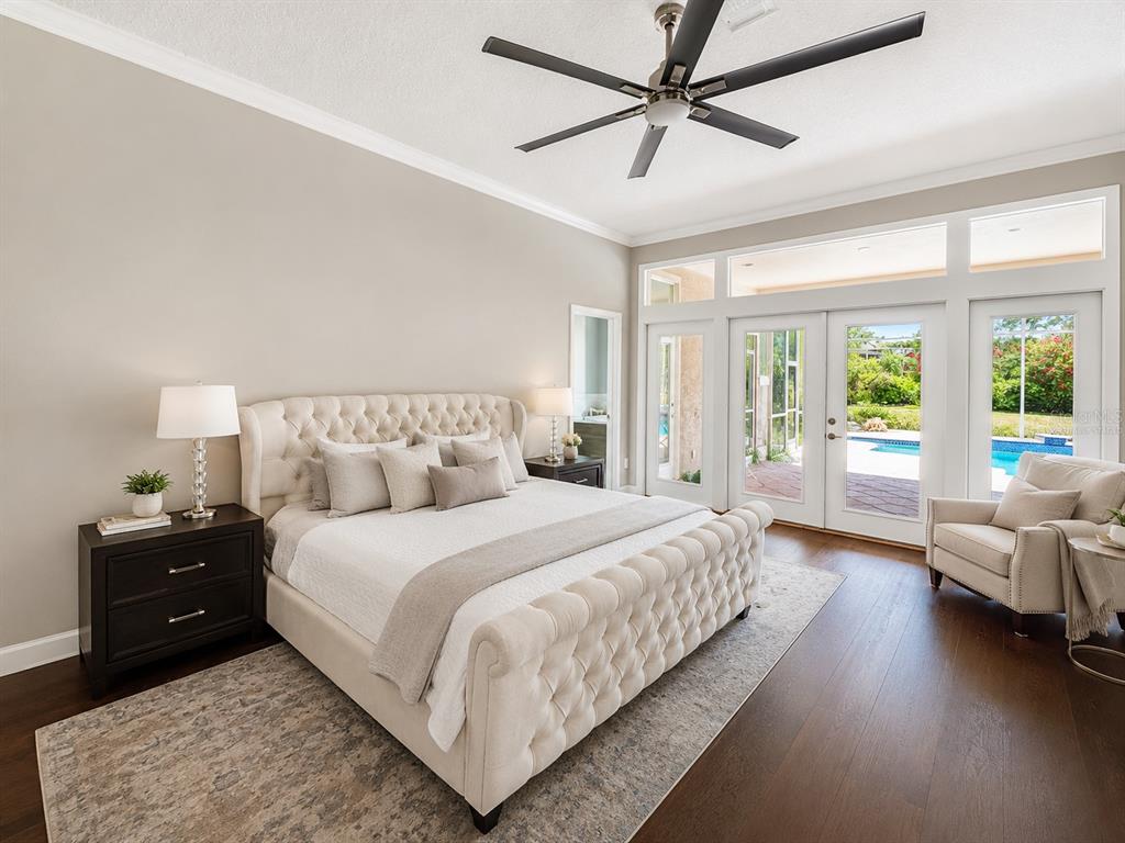 An open-concept living room and kitchen featuring a large sectional, fireplace, and kitchen island — 2260 LANGLEY CIRCLE, ORLANDO, FL
