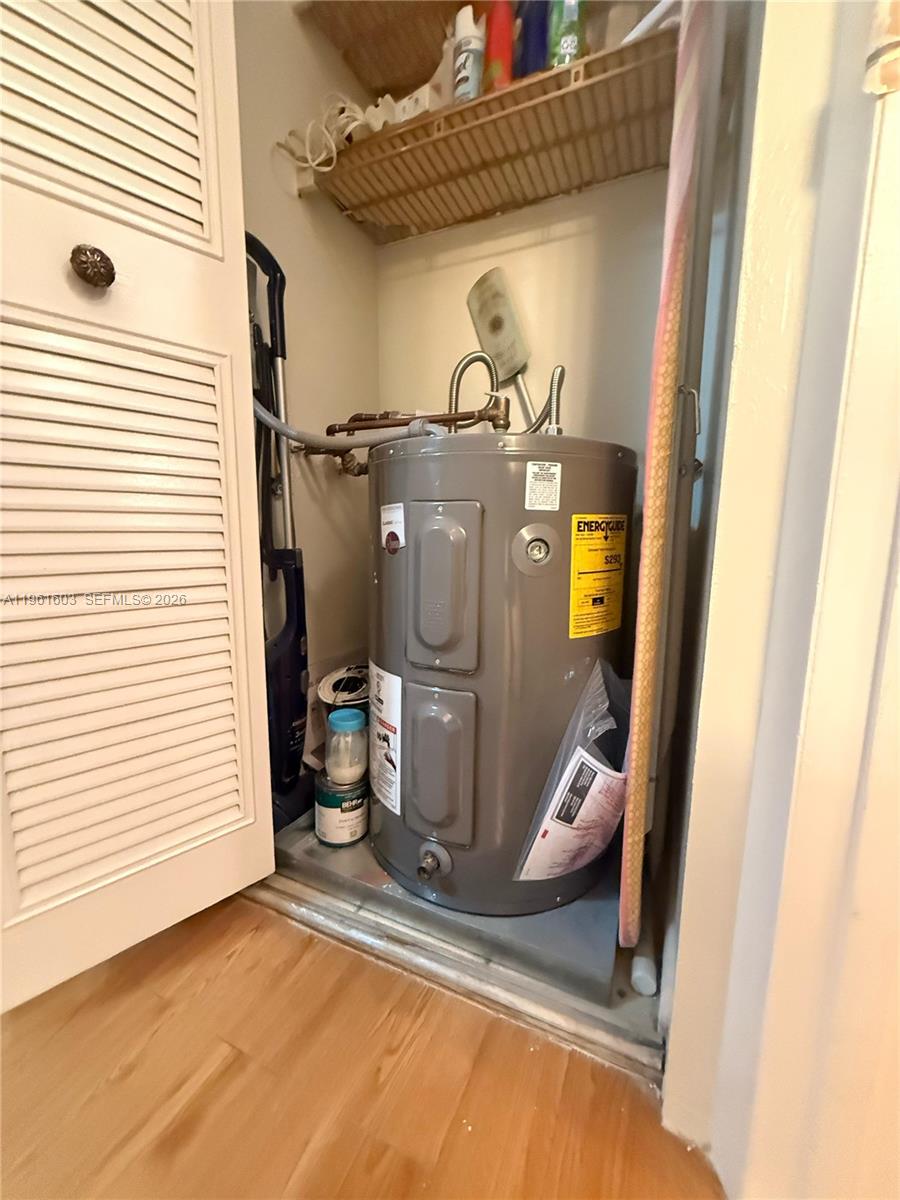 A water heater is installed inside a small closet with a louvered door — 5180 E Sabal Palm Blvd # 133, Tamarac FL 33319, TAMARAC, FL