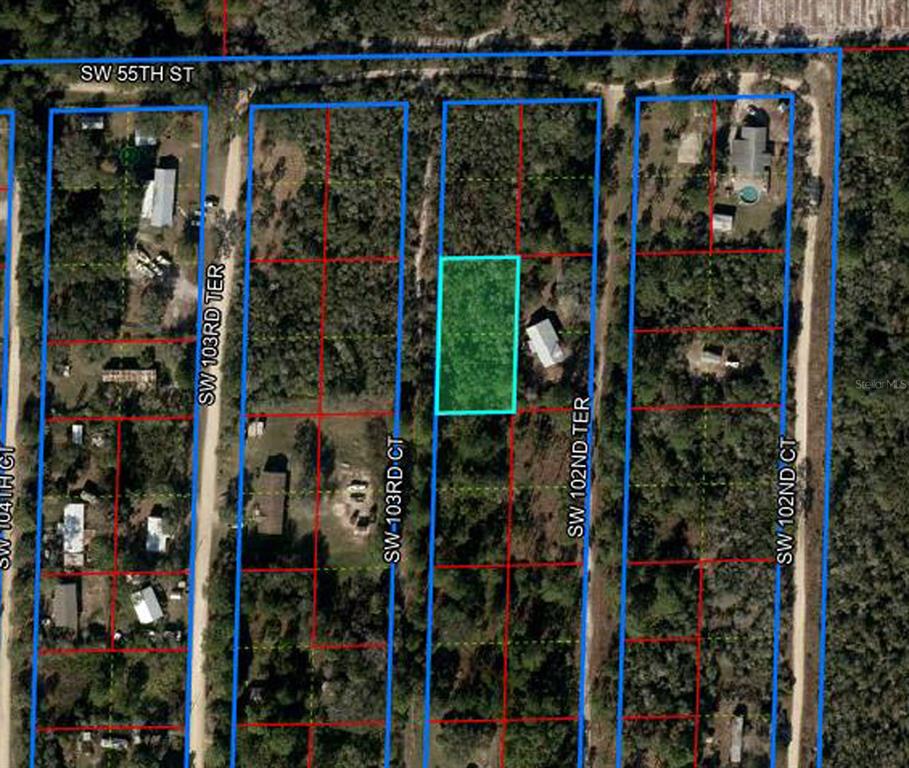 This is an aerial map showing a highlighted vacant lot among residential properties and streets — 5551 SW 103RD COURT, CEDAR KEY, FL