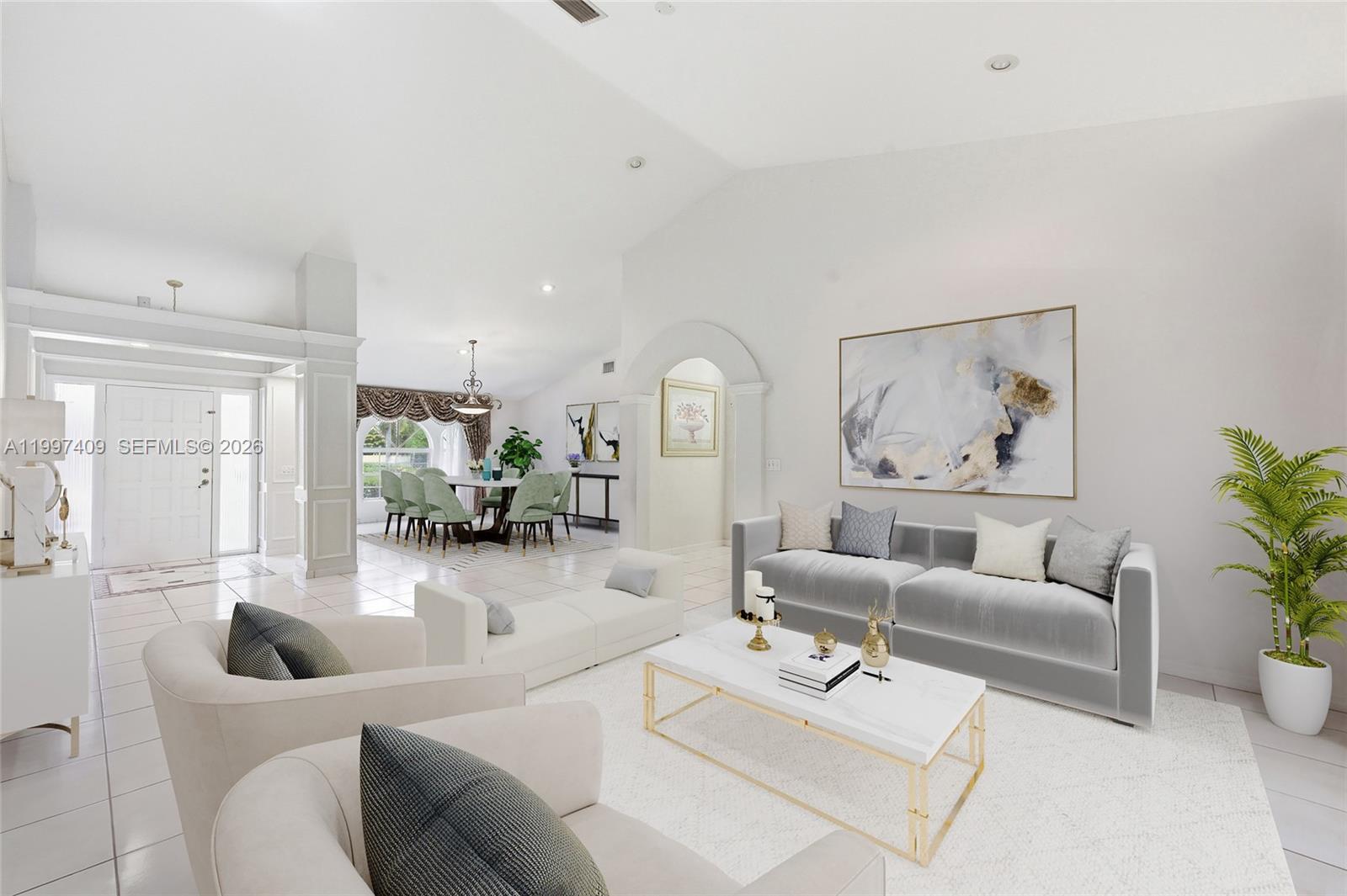 A bright, open-concept living and dining area features white tile floors and modern neutral furniture — 11400 NW 20th Ct, Plantation FL 33323, PLANTATION, FL