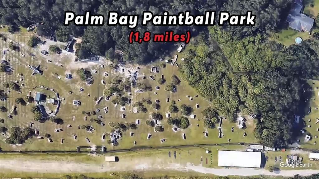 This is an aerial view of an outdoor paintball park with various obstacles and structures — 2760 FIELDS AVENUE SE, PALM BAY, FL
