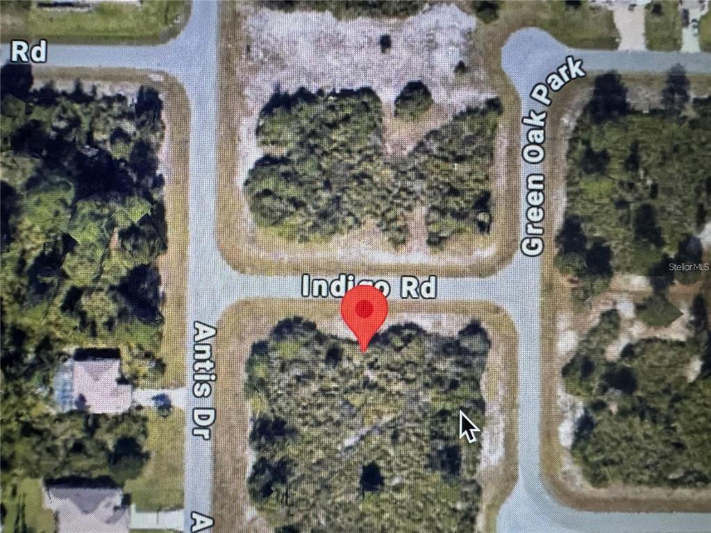 An aerial map view shows a vacant, wooded residential lot marked by a red pin — 105 GREEN OAK DRIVE, ROTONDA WEST, FL