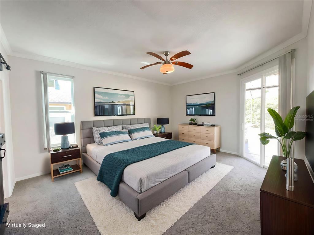 A bedroom features a gray upholstered bed, two nightstands, a dresser, and a ceiling fan — 4241 SETTLERS COURT, ST CLOUD, FL