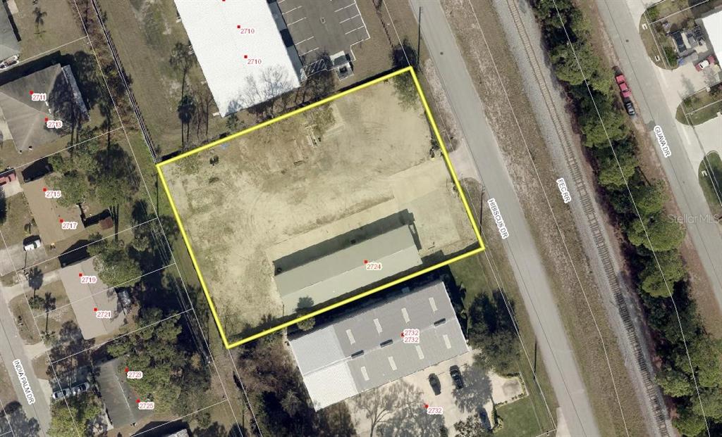 This is an aerial view of a vacant lot with a single building — 2724 HIBISCUS DRIVE, EDGEWATER, FL