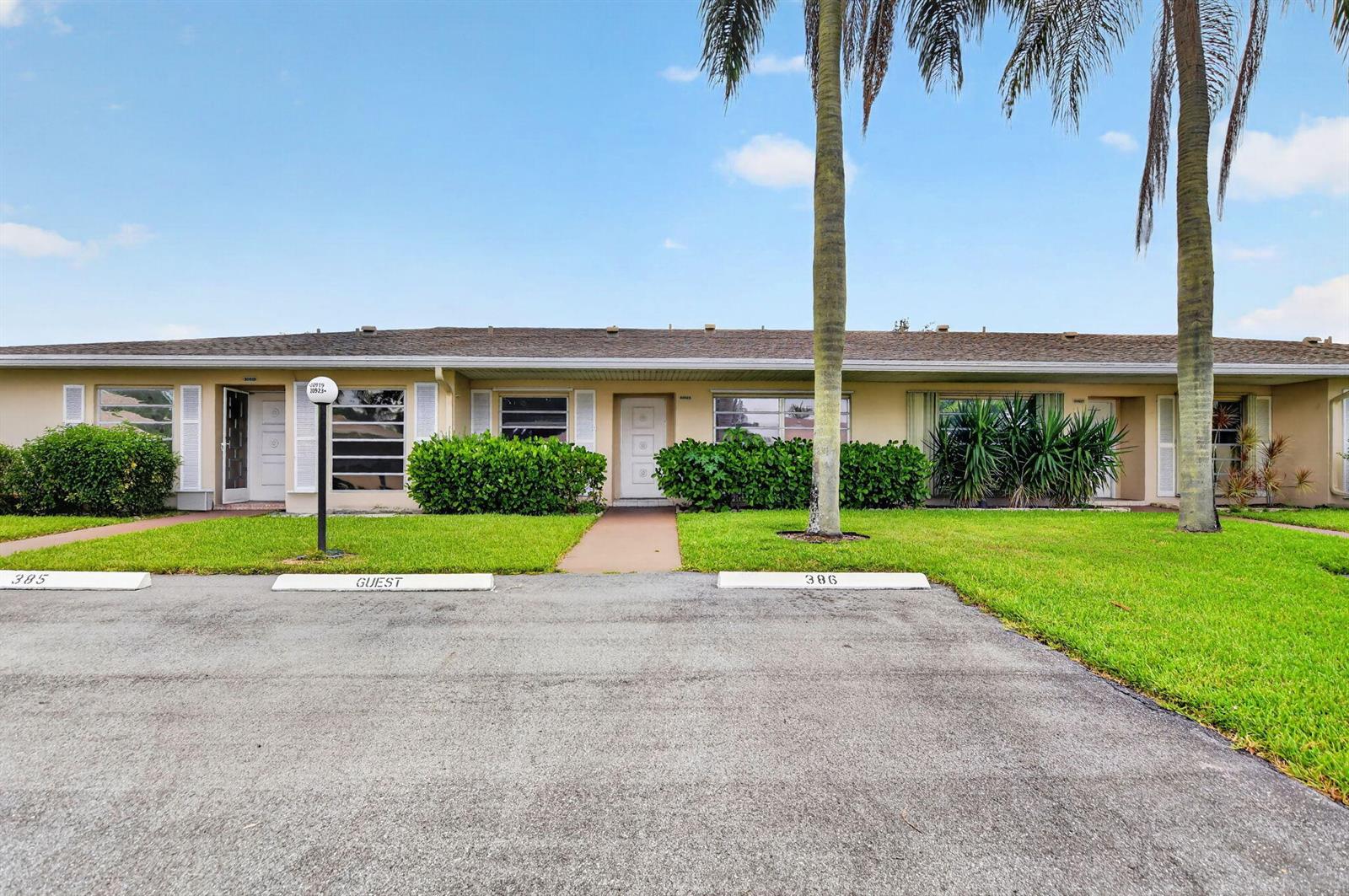 A single-story residential building with two front doors, parking spaces, and palm trees — 20923 Sedgewick Drive # 386, Boca Raton FL 33433, BOCA RATON, FL