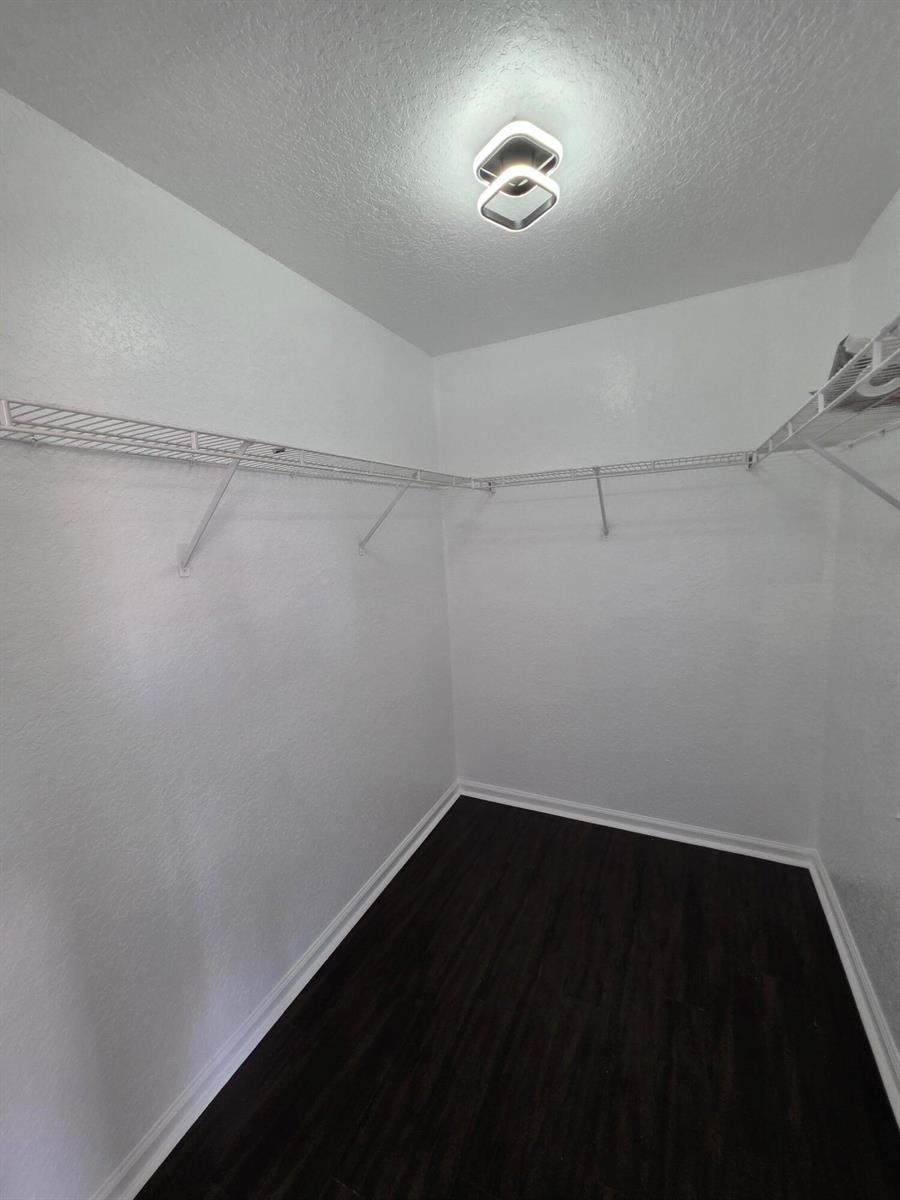 A dining room features white walls, large marble-look floor tiles, a modern chandelier, and blinds — 5466 NW 92nd Avenue, Sunrise FL 33351, SUNRISE, FL