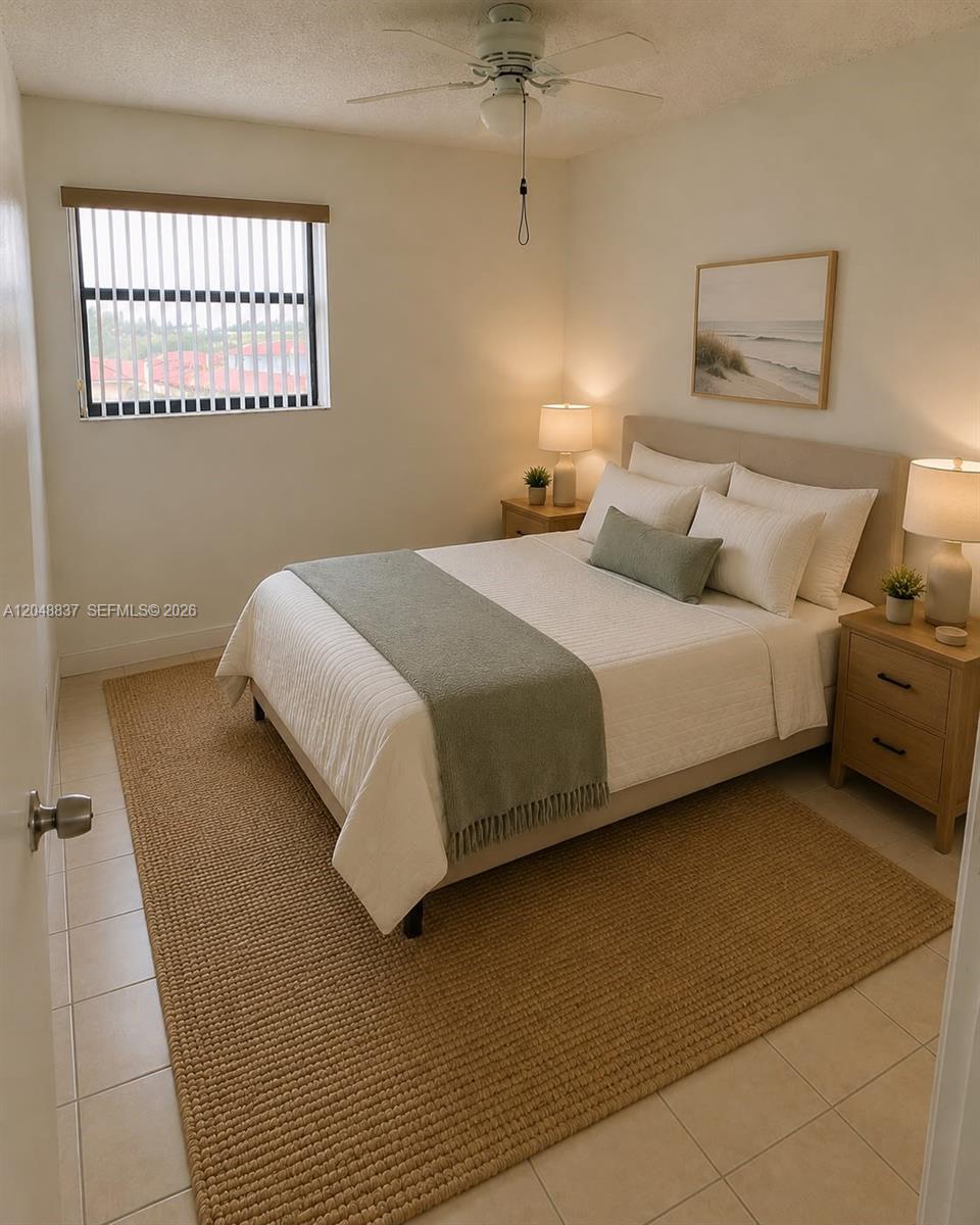 A bedroom features a bed with a green runner, two nightstands, and a window — 8075 NW 7th St # 520, Miami FL 33126, MIAMI, FL